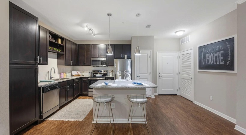 a kitchen with black appliances