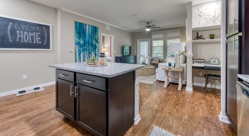kitchen island facing living room and study area