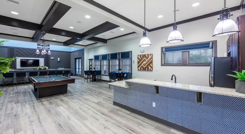 a kitchen with a bar and a large counter